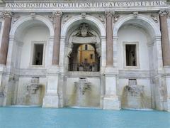 Detailed view of a historic stone fountain in Rome