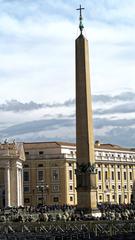 Obelisk at St. Peter's Square with chairs set up, Vatican buildings in the background