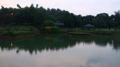 Japanese garden in Pune with a flowing river surrounded by lush greenery