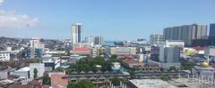 Balikpapan cityscape with greenery and coastal view