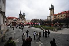 a panoramic view of Prague with historic buildings and the Vltava River