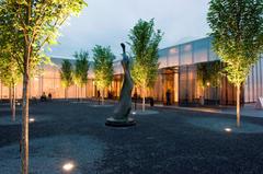 West Building entrance and courtyard garden at night