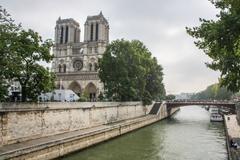 West facade of Notre-Dame de Paris with Petit-Pont bridge