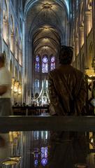 Woman admiring a church in Paris