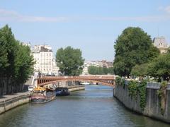 Pont au Double bridge over the Seine River in Paris viewed from Pont de l'Archevêché