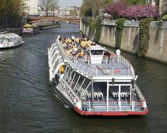 Bateaux-Mouches on Seine River near Notre-Dame, Paris