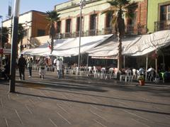 Plaza Garibaldi in Mexico City at sunset with people and mariachi bands