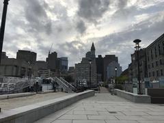 Long Wharf in Boston with docked boats and city skyline