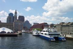 Long Wharf in downtown Boston with several Boston Harbor Cruises boats docked