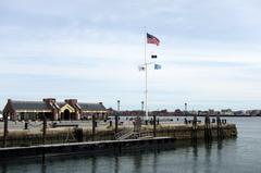 long pier extending from aquarium into the water