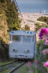 Funicular del Tibidabo ascending the hill with a view of the lush greenery around