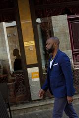 man walking on a city street in Bordeaux, France