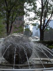 globe fountain at Kendall Square with Longfellow Bridge in the background