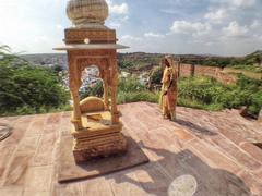 backside of Mehrangarh Fort with an old temple frequented by locals