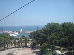 Barcelona harbor with boats and cityscape