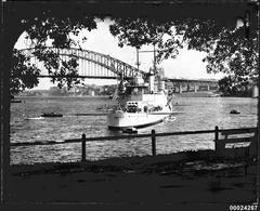 USS ASTORIA with Sydney Harbour Bridge in the background