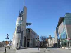 Pointe-à-Callière museum in Montreal with L'Éperon on the left and La Maison-des-Marins on the right