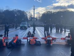 Letzte Generation climate demonstration blockade action at Luitpoldbrücke in Munich on November 21, 2022