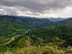 vibrant green mountains with flowing streams in Mavdhar village during rainy season