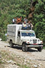 Tribal villagers using terrain vehicles and taxis in Chamoli