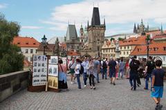 Scenic view of Charles Bridge over Vltava River in Prague with historical buildings in the background