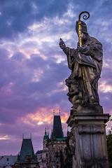 Charles Bridge at night with illuminated buildings, Prague