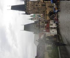 Charles Bridge in Prague during rain with Malostranská mostecká věž in the background