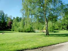 Eppendorfer Park with open meadows and former pond now a biotope in Hamburg