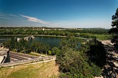 Panoramic view of the ramparts of Avignon, Pont Saint-Bénézet, and Rhône valley from Jardin des Doms