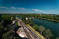 View over Avignon from Jardin des Doms, showing city ramparts, Boulevard de la Ligne, Rhône river bank, and Pont Saint-Bénézet (Pont d'Avignon)