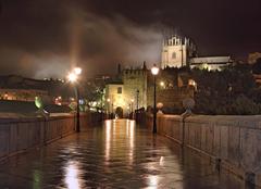 Rain and mist over El Puente de San Martín in Toledo, Spain