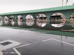 Reflection of Abu Dhabi bus station in the rain