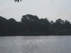 Dharmasagar pond at noon with sun reflecting on the water