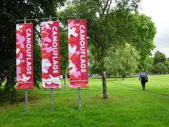 Geraldine Mary Harmsworth Park with bright red banners for an exhibition at the Imperial War Museum