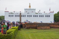 Buddha Jayanti celebration with a statue of Buddha adorned with flowers and offerings