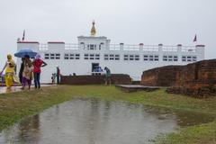 Buddha Jayanti celebration with a large Buddha statue and devotees offering prayers