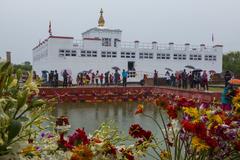 Buddha Jayanti Festival celebration featuring a large Buddha statue adorned with flowers and offerings in Nepal