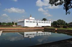 Panoramic view of Lumbini with lush greenery and traditional structures