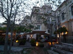 street view in Plaka, Athens with historical buildings and pedestrians