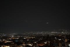 Athens at night with Mount Parnes in the distance