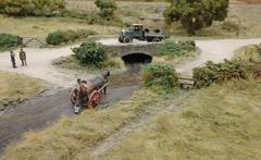 people collecting water in a village diorama at Pendon Museum