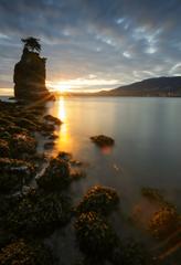 Long exposure of a sunset at Siwash Rock in Stanley Park