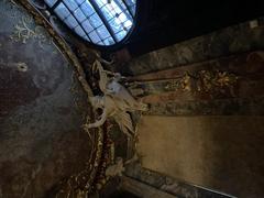 Statue of an angel above the entrance door in Asamkirche, Munich's vestibule