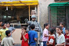 1st Sgt. Steven Farr jokes with Iraqi children in Baghdad's Adhamiyah neighborhood