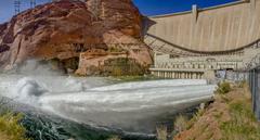 Jets of water released from Glen Canyon Dam during high-flow experiment with dam and canyon walls in background