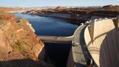 Glen Canyon Dam and Lake Powell in Arizona with blue and red-brown landscape