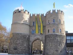 Kölner Hahnentorburg decorated with flags of the Ehrengarde during Carnival