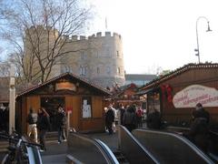 U-Bahn exit at Rudolfplatz with view to Hahnentorburg during Christmas market