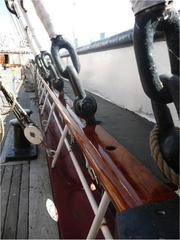 BALCLUTHA's newly varnished starboard pinrail