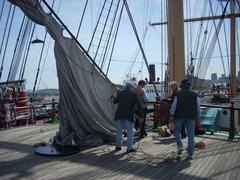 volunteer crew bending on mizzen staysail